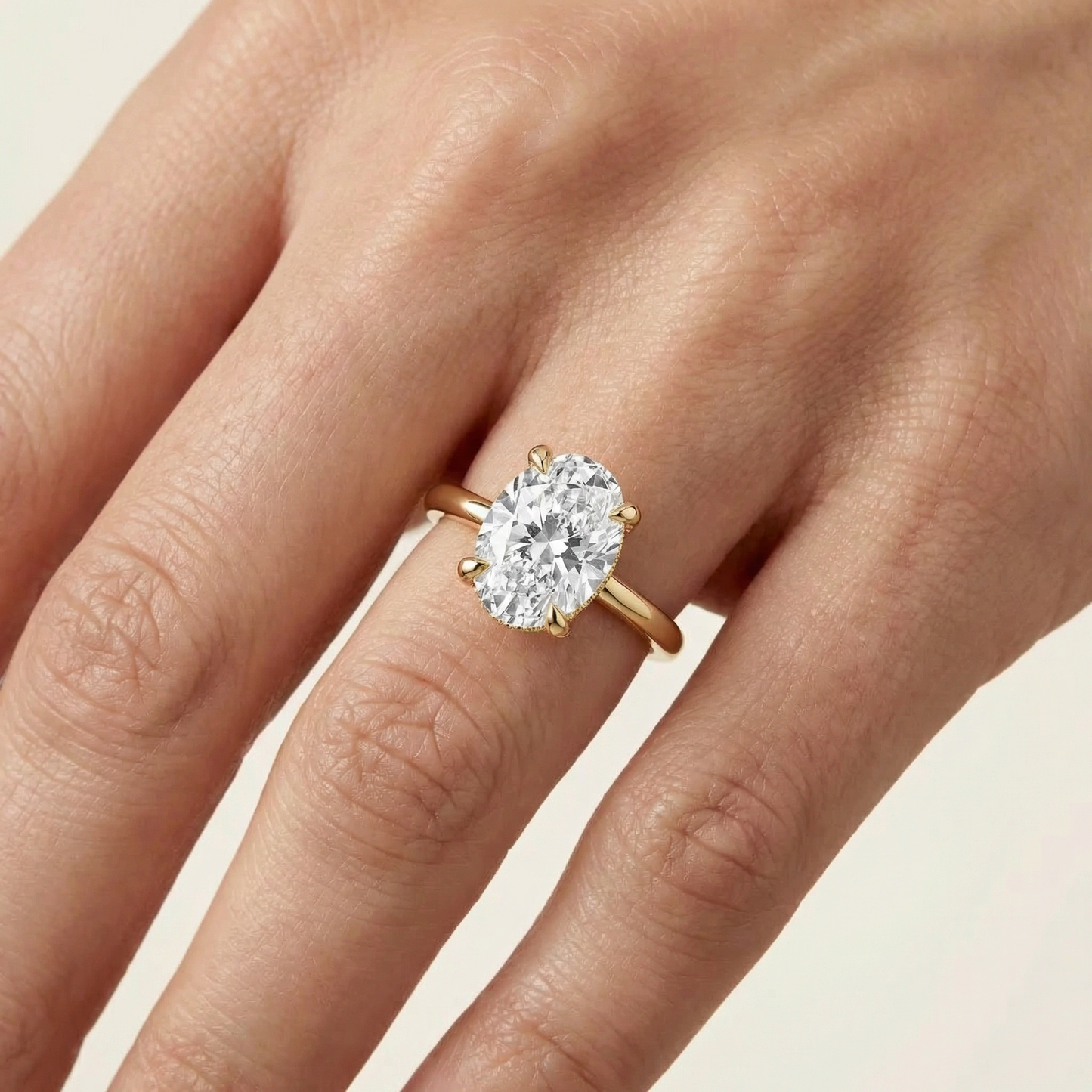 The Solitaire, Oval-cut Diamond Ring with Hidden Halo