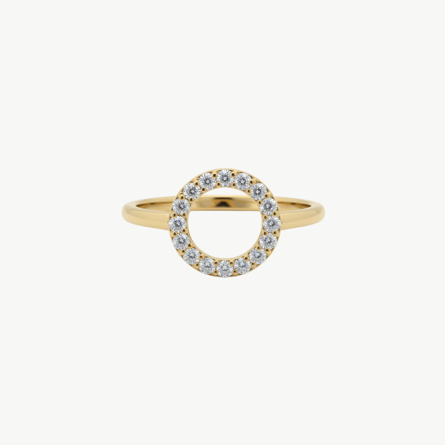 Gold ring with diamond accents on a white background