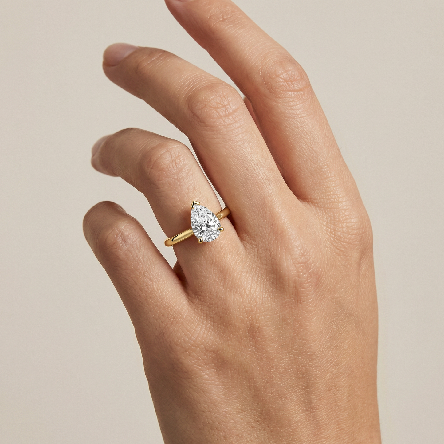 The Solitaire III, Pear-cut Diamond Ring with Wrapped Hidden Halo