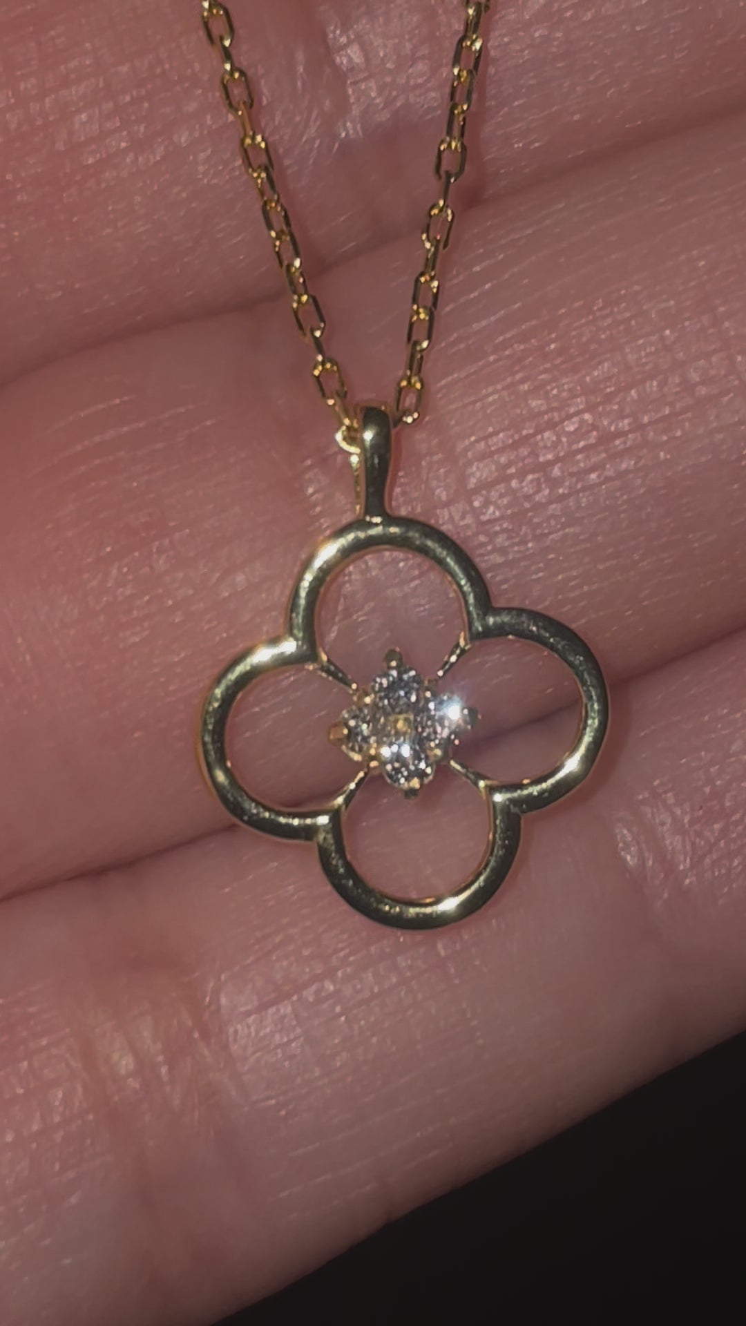 gold necklace with floral design and diamonds